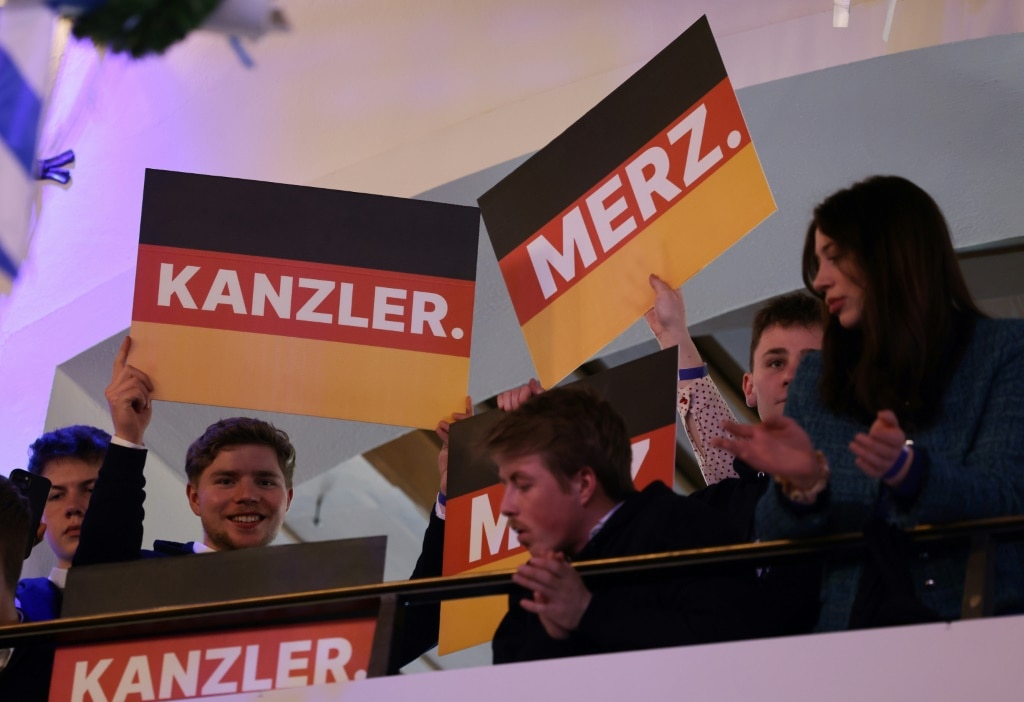 German vote winner Merz faces tough talks to build govt