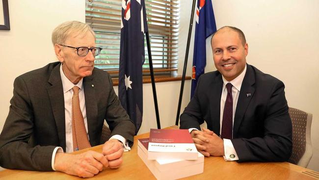 Commissioner Kenneth Hayne and Treasurer Josh Frydenberg (right) are seen with the final report from the Royal Commission into Misconduct in the Banking, Superannuation and Financial Services Industry, at Parliament House in Canberra. Picture: KYM SMITH