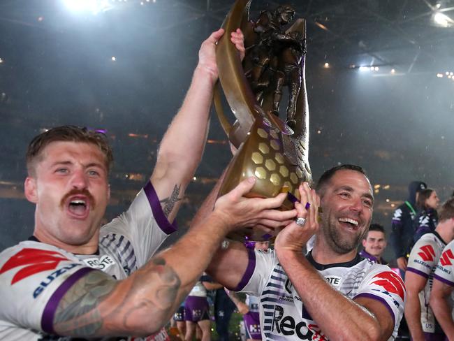 SYDNEY, AUSTRALIA - OCTOBER 25: Cameron Munster of the Storm and Cameron Smith of the Storm pose with the Premiership trophy after winning the 2020 NRL Grand Final match between the Penrith Panthers and the Melbourne Storm at ANZ Stadium on October 25, 2020 in Sydney, Australia. (Photo by Cameron Spencer/Getty Images)