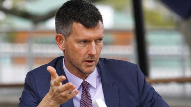 Transport Minister Mark Bailey speaking with Ann Wason Moore. Picture: Tertius Pickard.