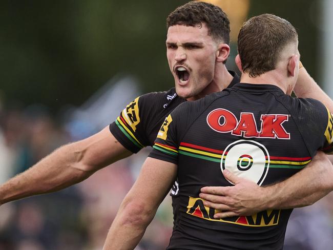 PENRITH, AUSTRALIA - AUGUST 04: Nathan Cleary of the Panthers celebrates scoring a try with team mates during the round 22 NRL match between Penrith Panthers and Newcastle Knights at BlueBet Stadium, on August 04, 2024, in Penrith, Australia. (Photo by Brett Hemmings/Getty Images)