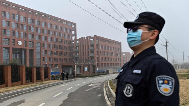 A security guard at the WIV as members of the World Health Organisation (WHO) team visit the institute. Picture: AFP.