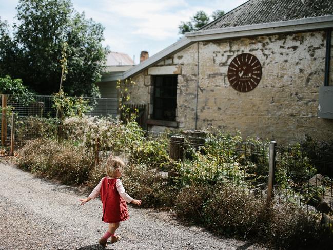 One of Jodi Wilson’s children explores a Tassie town, as featured in Practising Simplicity by Jodi Wilson.