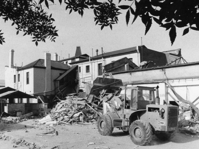 And she’s nearly gone — a bulldozer removes the rear veranda.