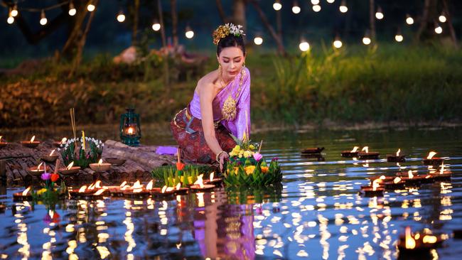 Making an offering for Loy Krathong in Thailand.