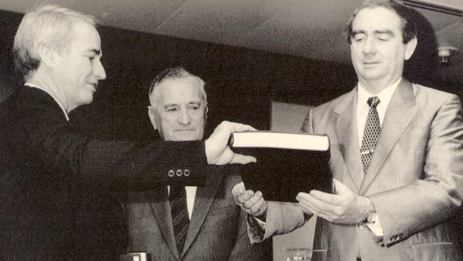 Tony Fitzgerald QC, Bill Gunn and former premier Mike Ahern with the report of the Commission of Inquiry in 1989.