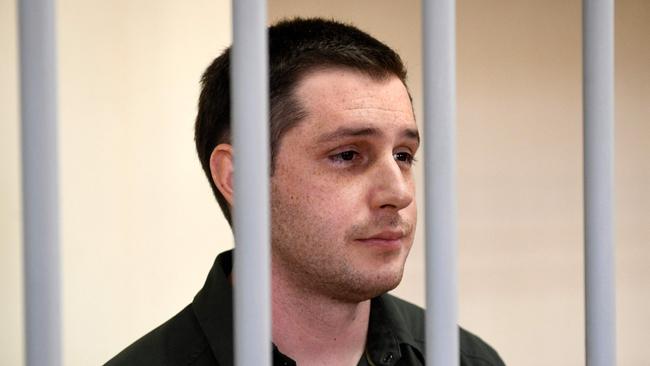 In this file photo taken on March 11, 2020 US ex-marine Trevor Reed stands inside a defendants' cage during a court hearing in Moscow. Picture: AFP.