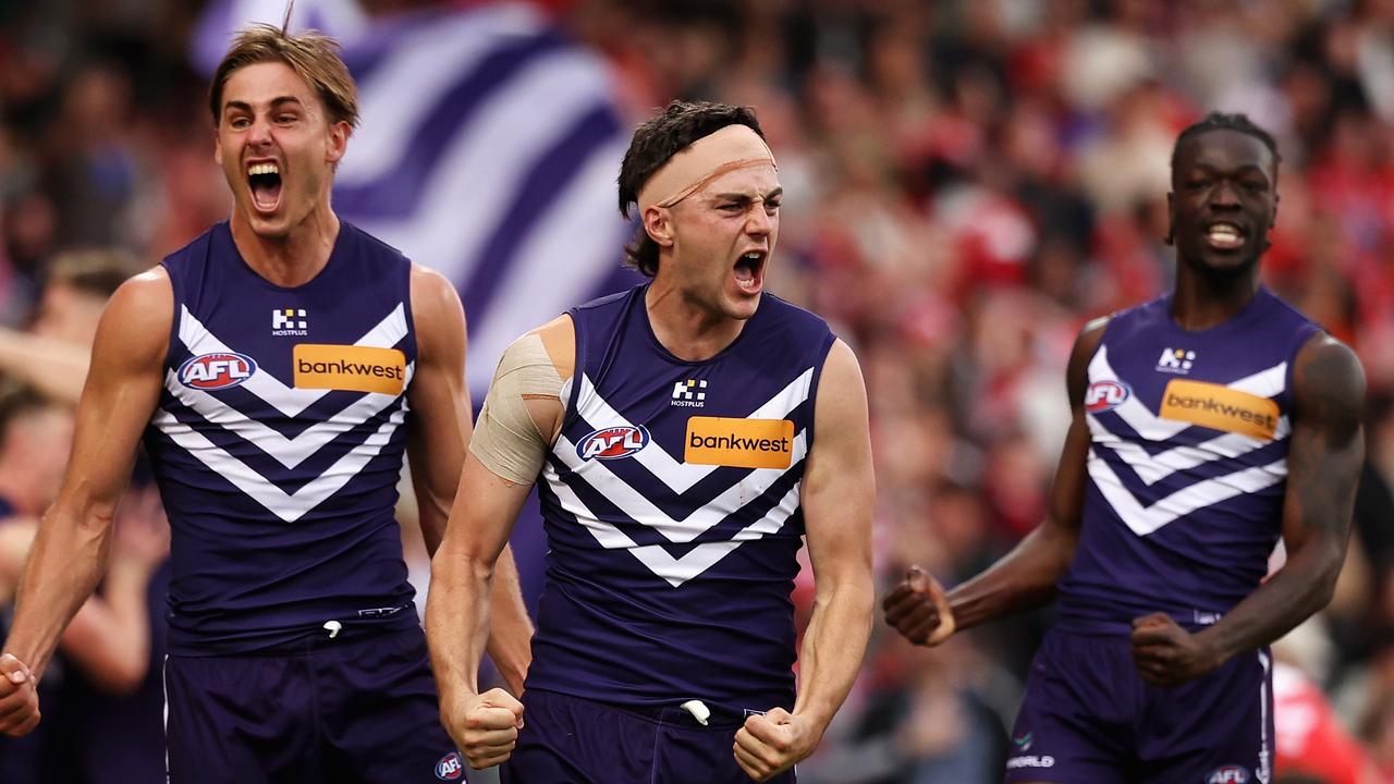 SYDNEY, AUSTRALIA - JUNE 29: Jordan Clark of the Dockers and team mates celebrate winning the round 16 AFL match between Sydney Swans and Fremantle Dockers at SCG, on June 29, 2024, in Sydney, Australia. (Photo by Cameron Spencer/Getty Images)