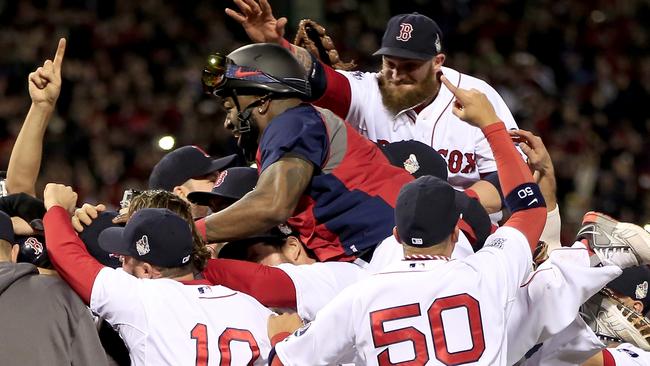 The Boston Red Sox celebrate after defeating the St. Louis Cardinals in Game Six of the 2013 World Series.