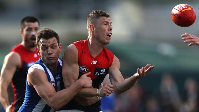 Shaun Higgins puts the clamps on Jake Melksham during North Melbourne’s last-round win. Picture: Robert Cianflone/Getty Images.