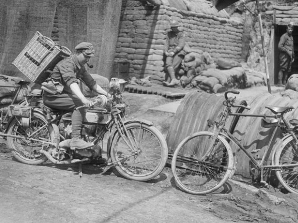 This dispatch rider’s basket contains carrier pigeons. In the background is the Signal Office and Headquarters of the 4th Australian Divisional Signalling Company on the Vaulx- Beugny Road in France. Picture: Australian War Memorial