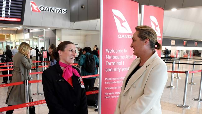 New Qantas CEO Vanessa Hudson (R) talks to airport staff during her first day on the job as the new airline boss at Tullamarine Airport.