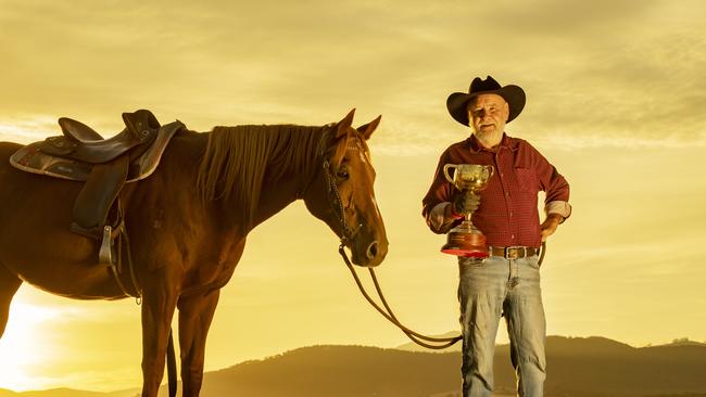 Charlie Lovick, famed High Country rider and Master of Horse for The Many From Snowy River films, has met an old friend again in the Melbourne Cup trophy to raise awareness for a large fundraising platform. Pictures: Zoe Phillips