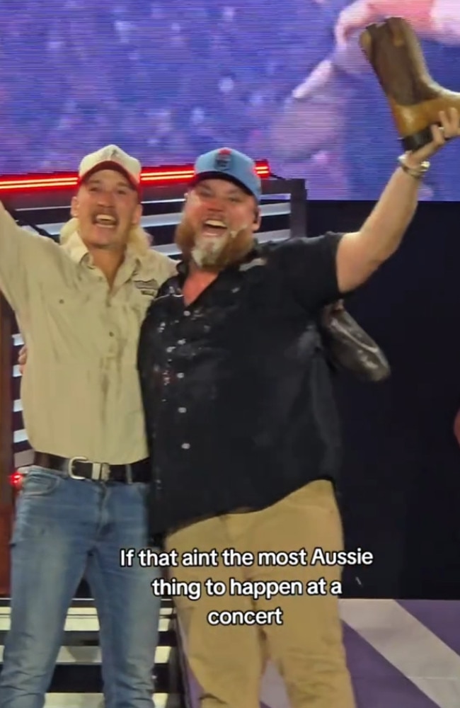 Ultra-marathon runner Nedd Brockmann did a shoey with US country music singer Luke Combs at his Sydney show. Picture: Accor Stadium / Supplied.