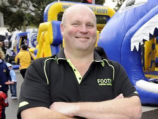  Glenn Smith has designed and created an '' Eels'' themed Jumping Castle. Glenn with the castle, outside the Parramatta stadi...