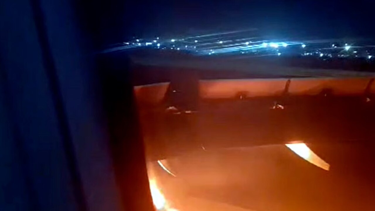 The engine burst into flames with 179 people on board. Picture: ViralPress.