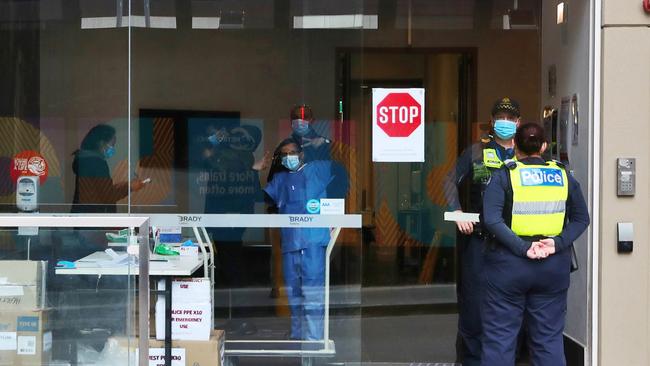 Police and staff at the Brady Hotel in Little La Trobe Street, Melbourne. Picture: Aaron Francis