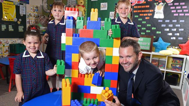 Trinity College North's Trent Stafford is one of the few male junior primary teachers. Pictured in his classroom with reception kids Lily, Chloe, Tyler and Ebony. Photo: Tom Huntley