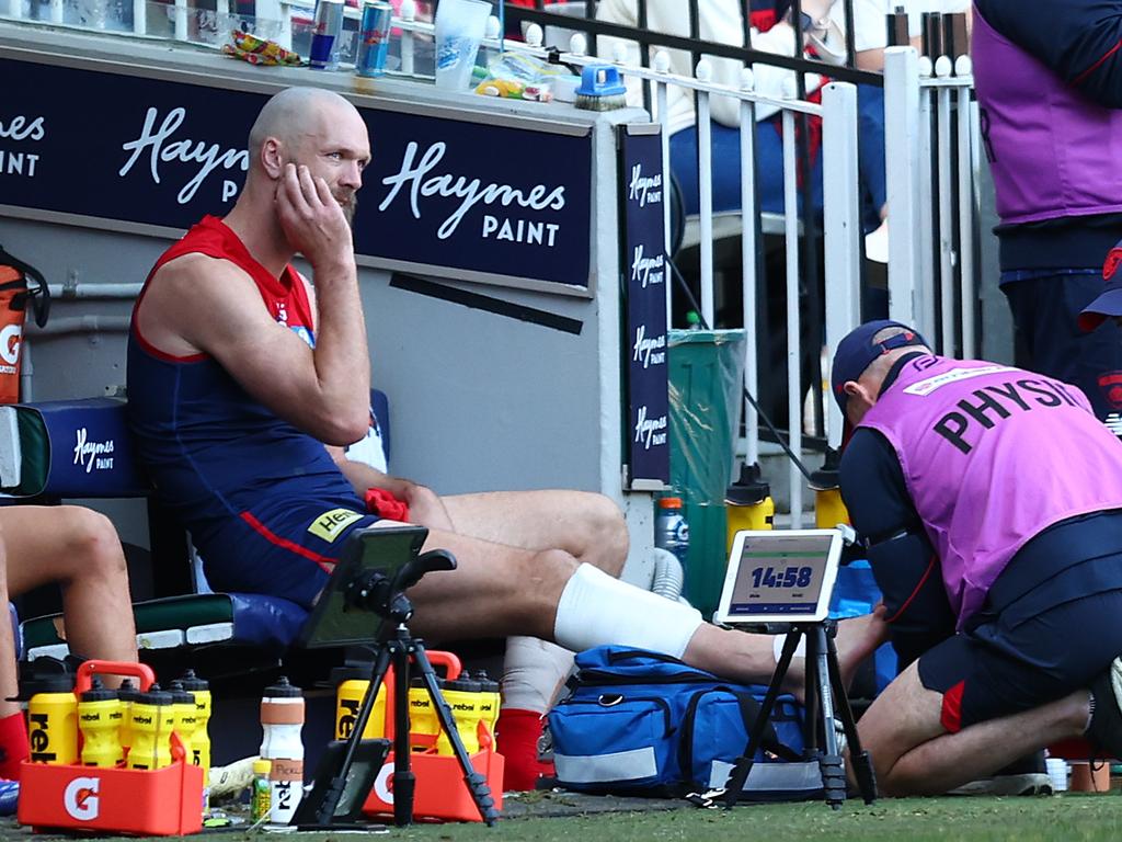 Max Gawn of the Demons receives attention during the club’s win over West Coast. Picture: Graham Denholm/AFL Photos/via Getty Images.