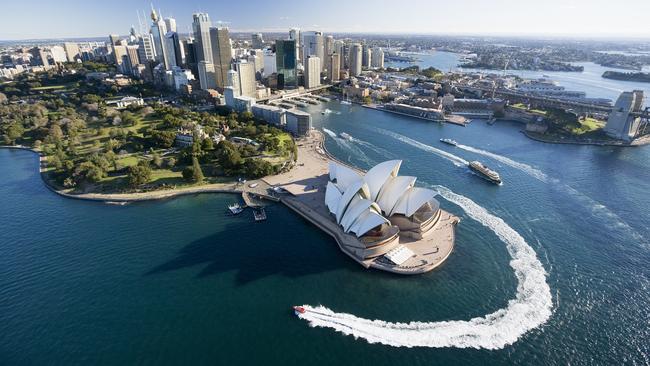 Aerial of Sydney and the Harbour foreshore including Opera House. Jet boat tours in foreground Image supplied by Destination NSW Mandatory Credit: Hamilton Lund/Destination NSW