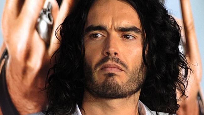 (FILES) Actor Russell Brand poses on the red carpet as he arrives for the premiere of the comedy movie "Get Him to the Greek" from Universal Pictures at the Greek Theatre in Los Angeles on May 25, 2010. British comedian and actor Russell Brand has been accused of rape, sexual assaults and emotional abuse during a seven-year period, according to the results of a media investigation published on September 16, 2023. (Photo by MARK RALSTON / AFP)