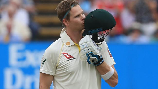 Australia's Steve Smith kisses his helmet as he celebrates reaching his century during play on the fourth day of the first Ashes cricket Test match between England and Australia at Edgbaston in Birmingham, central England on August 4, 2019. (Photo by Lindsey Parnaby / AFP) / RESTRICTED TO EDITORIAL USE. NO ASSOCIATION WITH DIRECT COMPETITOR OF SPONSOR, PARTNER, OR SUPPLIER OF THE ECB