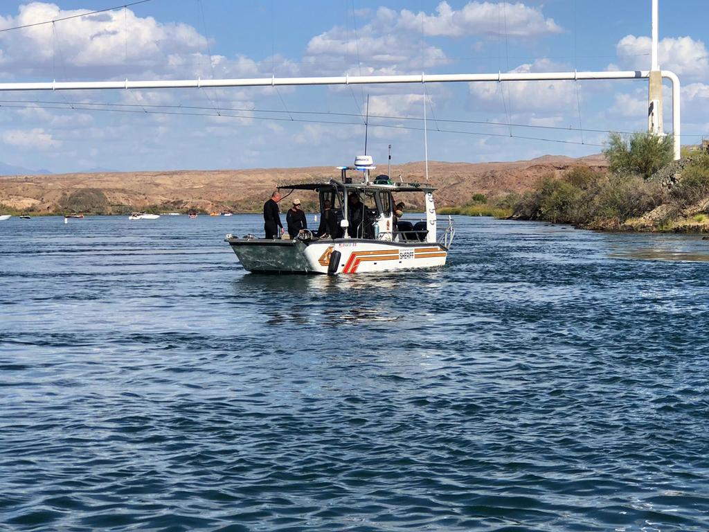 A search and recovery boat scourers the Colorado River for the missing people. Picture: San Bernardino County Sheriff's Office via AP