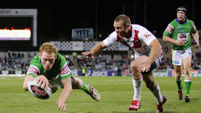 CANBERRA, AUSTRALIA — MARCH 29: Joel Monaghan of the Raiders beats the defence of Ben Hornby of the Dragons to score during the round three NRL match between the Canberra Raiders and the St George Illawarra Dragons at Canberra Stadium on March 29, 2008 in Canberra, Australia. (Photo by Mark Nolan/Getty Images)