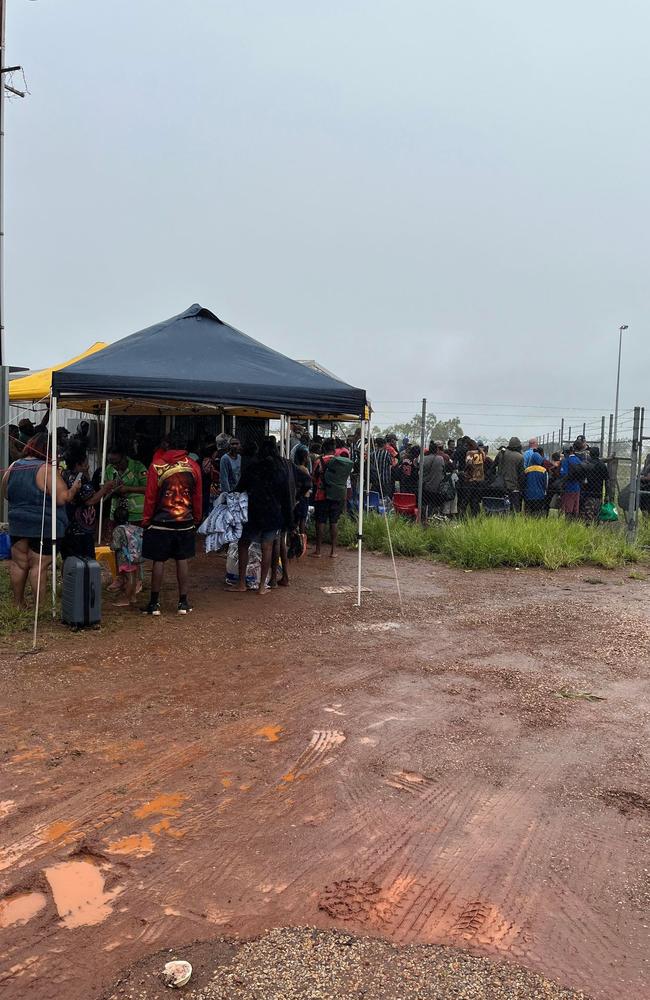 Residents in Kalkarindji at the town's airstrip awaiting evacuation from the flood-ravaged area. People from nearby Pigeon Hole and Damaragu were moved to Kalkarindji on March 1, 2023. Picture: Supplied