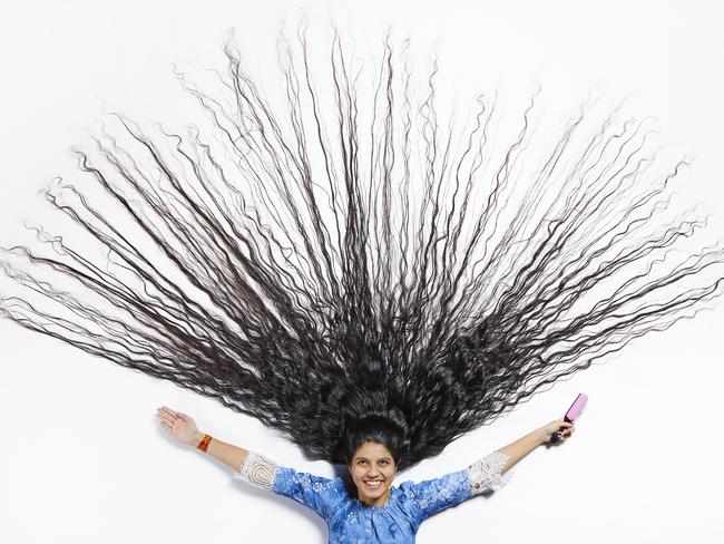 Nilanshi Patel now has the title of world’s Longest Hair On A Teenager. Picture: Paul Michael Hughes/Guinness World Records