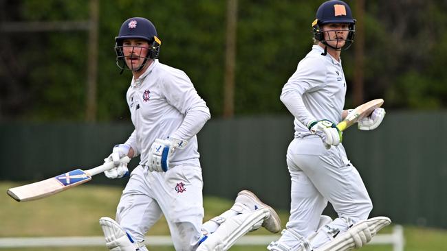 Melbourne’s Blake Thomson and Will Pucovski run between wickets. Picture: Andy Brownbill