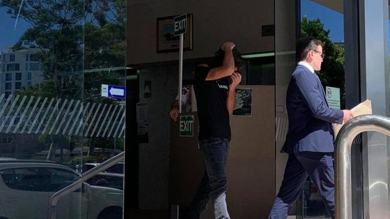 Andrea D'Onofrio covered his face following his first court appearance for a charge of dangerous operation of a motor vehicle causing death and leaving the scene without obtaining help. Picture: Felicity Ripper