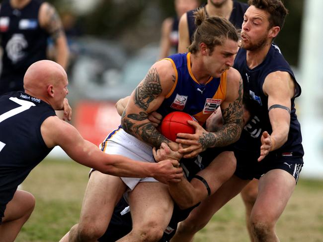 Jayden Depace is brought down in a tackle. Picture: Stuart Milligan