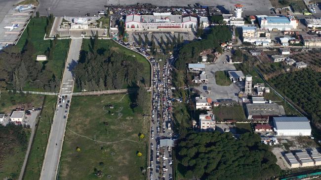 Cars queue as civilians take refuge from violence at the Hmeimim Russian base in Syria. Picture: AFP
