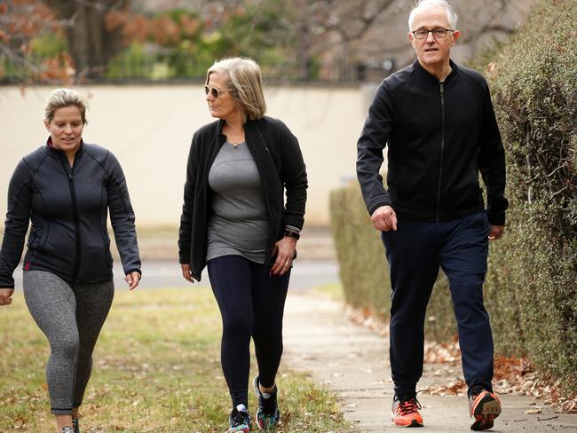 Betrayed: Former prime minister Malcolm Turnbull with his wife Lucy and daughter Daisy walking together in Canberra last week. Picture Jonathan Ng