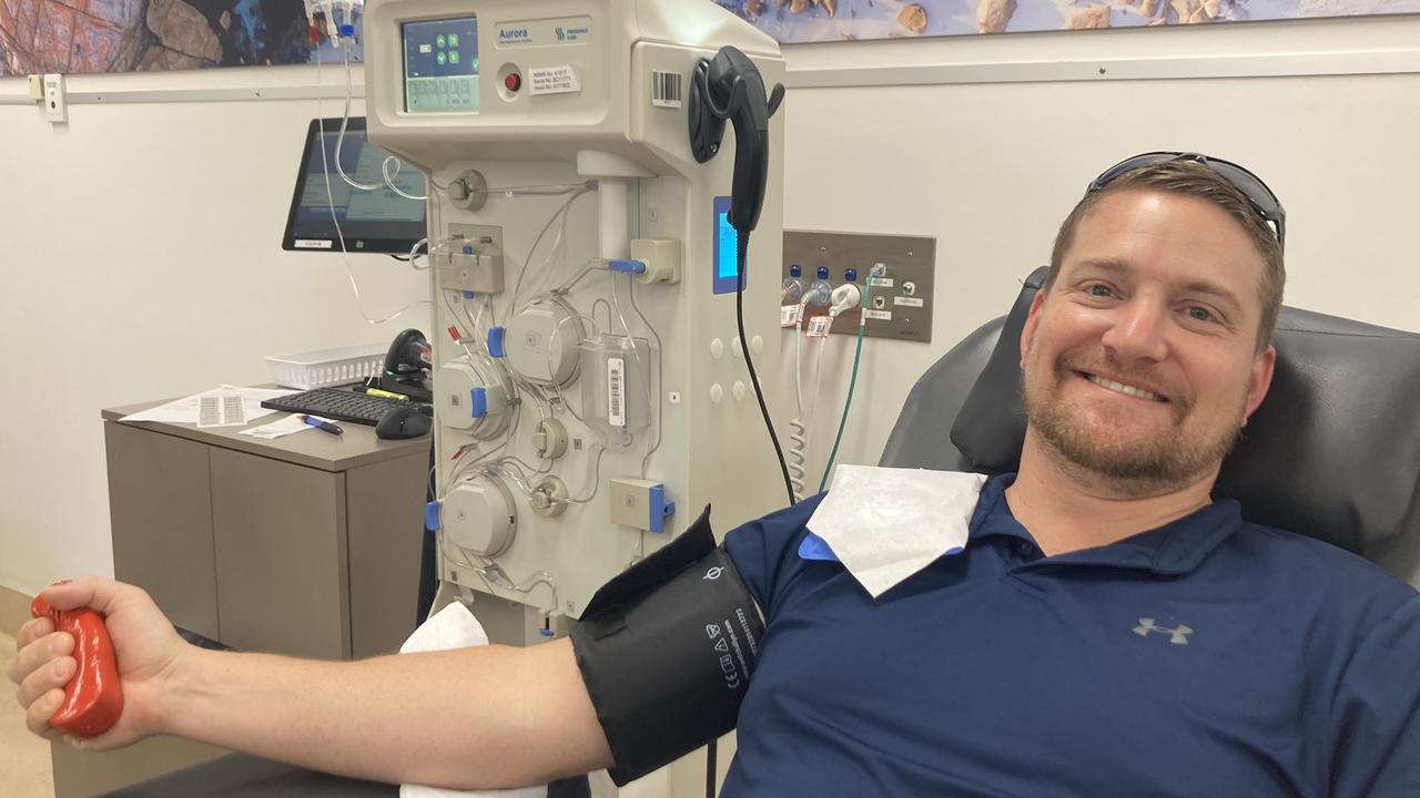 Cairns residents Dennis Bisset and Simon Morris donate blood while Red ...