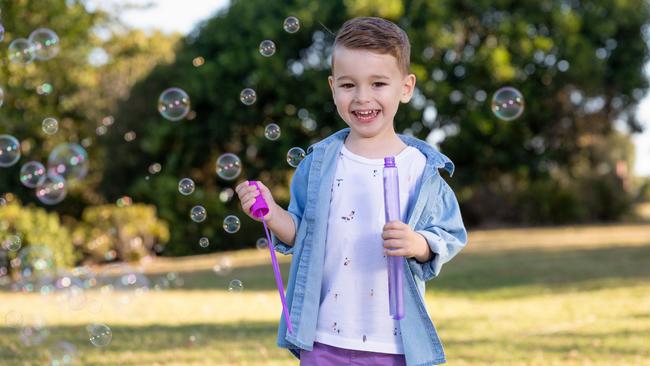 Teddy Beckett, 4, of Warner plays with bubbles in the park.