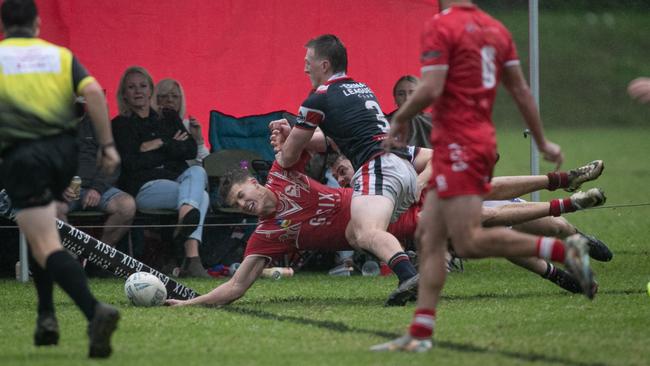 Josh Woutersz scores a spectacular try in the corner. Picture: Julian Andrews