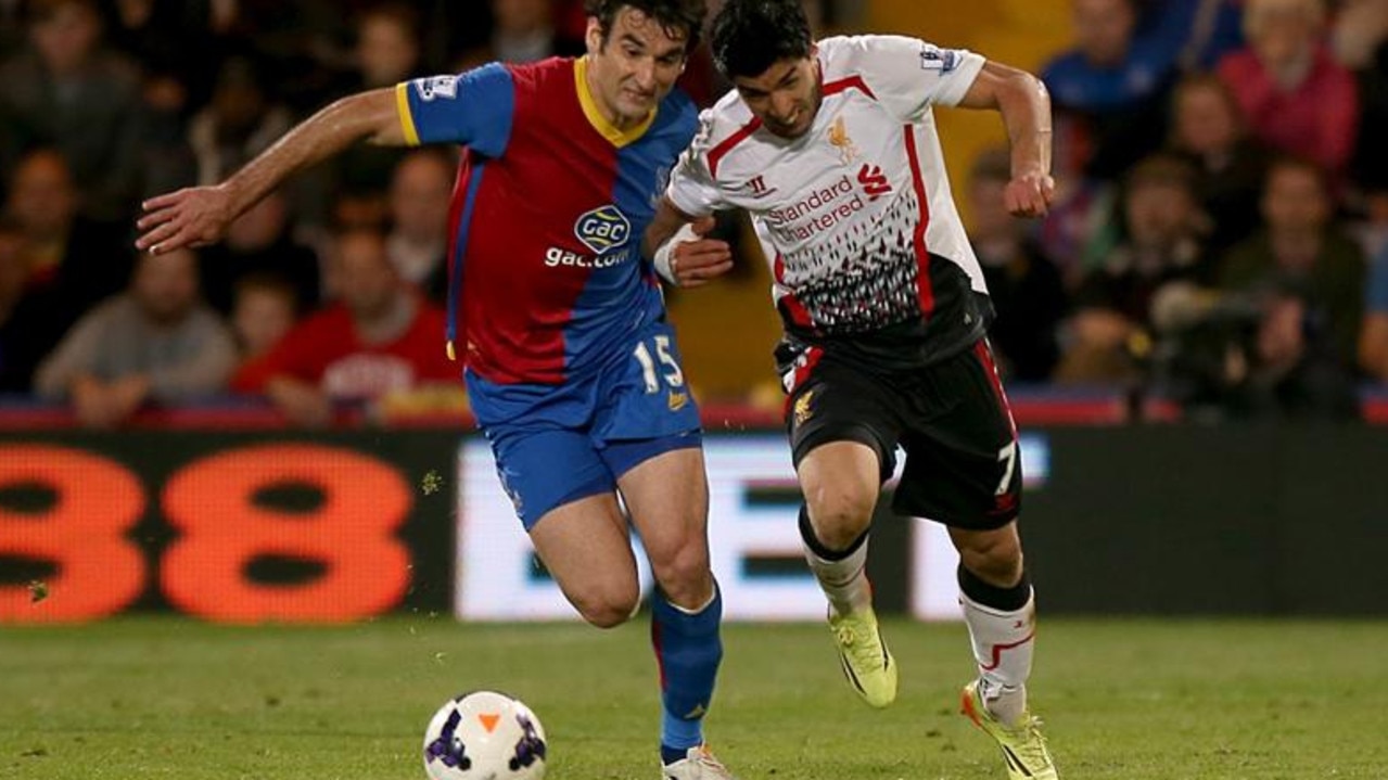 Liverpool's Luis Suarez (right) and Crystal Palace's Mile Jedinak (left) battle for the ball.