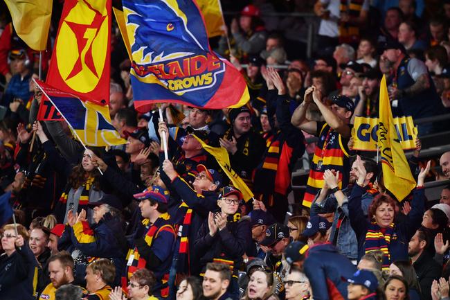 Crows supporters in full voice during the Round 7 match between the Adelaide Crows and the Fremantle Dockers at the Adelaide Oval. Oicture: David Mariuz/AAP