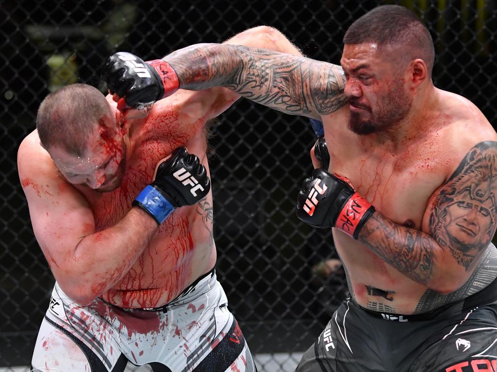 LAS VEGAS, NEVADA - MAY 22: (R-L) Justin Tafa of New Zealand punches Jared Vanderaa in their heavyweight bout during the UFC Fight Night event at UFC APEX on May 22, 2021 in Las Vegas, Nevada. (Photo by Chris Unger/Zuffa LLC)