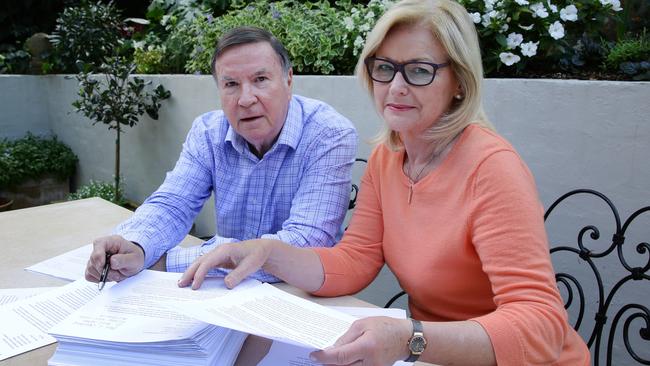 Mosman couple William and Jacquie Tuck with some of the letters addressed to the Queen which anti-merger residents from other communities wrote. Picture: Virginia Young