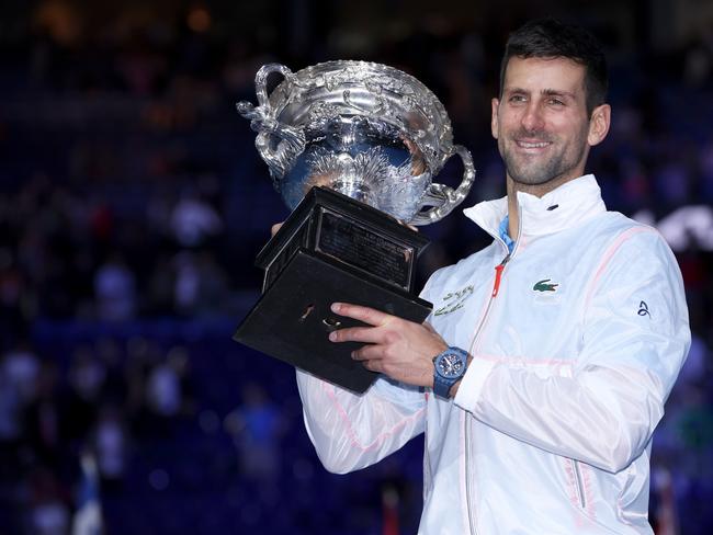 MELBOURNE, AUSTRALIA - JANUARY 29:  Novak Djokovic of Serbia poses for photographs with the Norman Brookes Challenge Cup after winning the Men's Singles Final match against Stefanos Tsitsipas of Greece during day 14 of the 2023 Australian Open at Melbourne Park on January 29, 2023 in Melbourne, Australia. (Photo by Clive Brunskill/Getty Images)