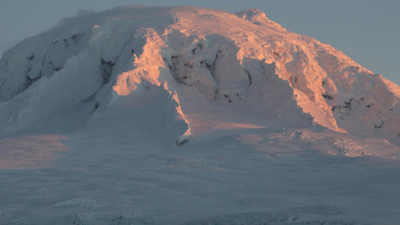 Sunset on a mountain peak at Heard and McDonald Islands. Photo: Bill Moorhead