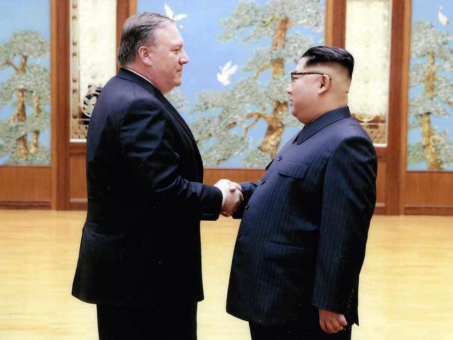 In this image released by the White House, then-CIA director Mike Pompeo shakes hands with North Korean leader Kim Jong-un in Pyongyang, during a 2018 trip. Picture: AP
