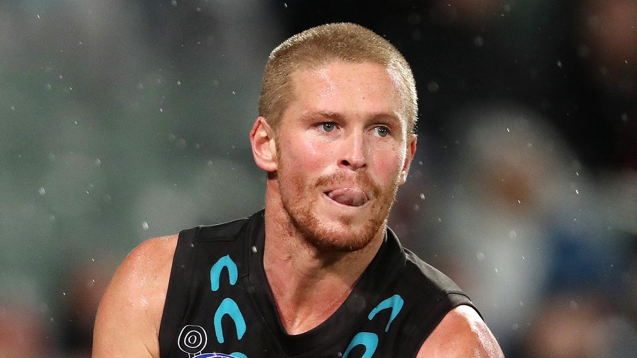 Key defender Tom Clurey was trialled on a wing earlier in pre-season. Picture: Sarah Reed/AFL Photos via Getty Images