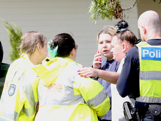 Police speak to those in shock at the scene. Picture: Alan Barber