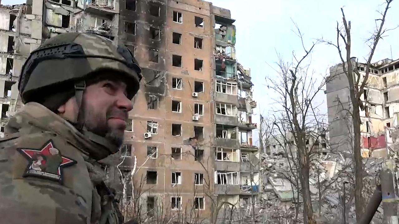 A soldier walks past a destroyed residential building in Avdiivka in Ukraine. Picture: AFP