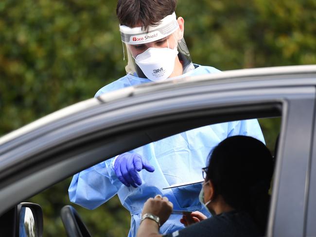 BRISBANE, AUSTRALIA - NewsWire Photos - SEPTEMBER 30, 2021.A health worker processes members of the public at a drive through Covid-19 testing clinic at Murarrie in Brisbane. Picture: NCA NewsWire / Dan Peled