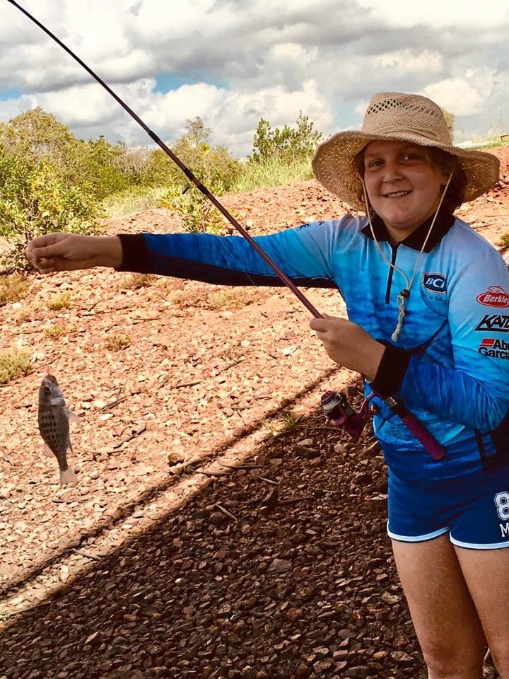 Elan Rizzetto, tiny grunter caught on squid bait on the Calliope River (under bridge near power station). Picture: Christina Durighello